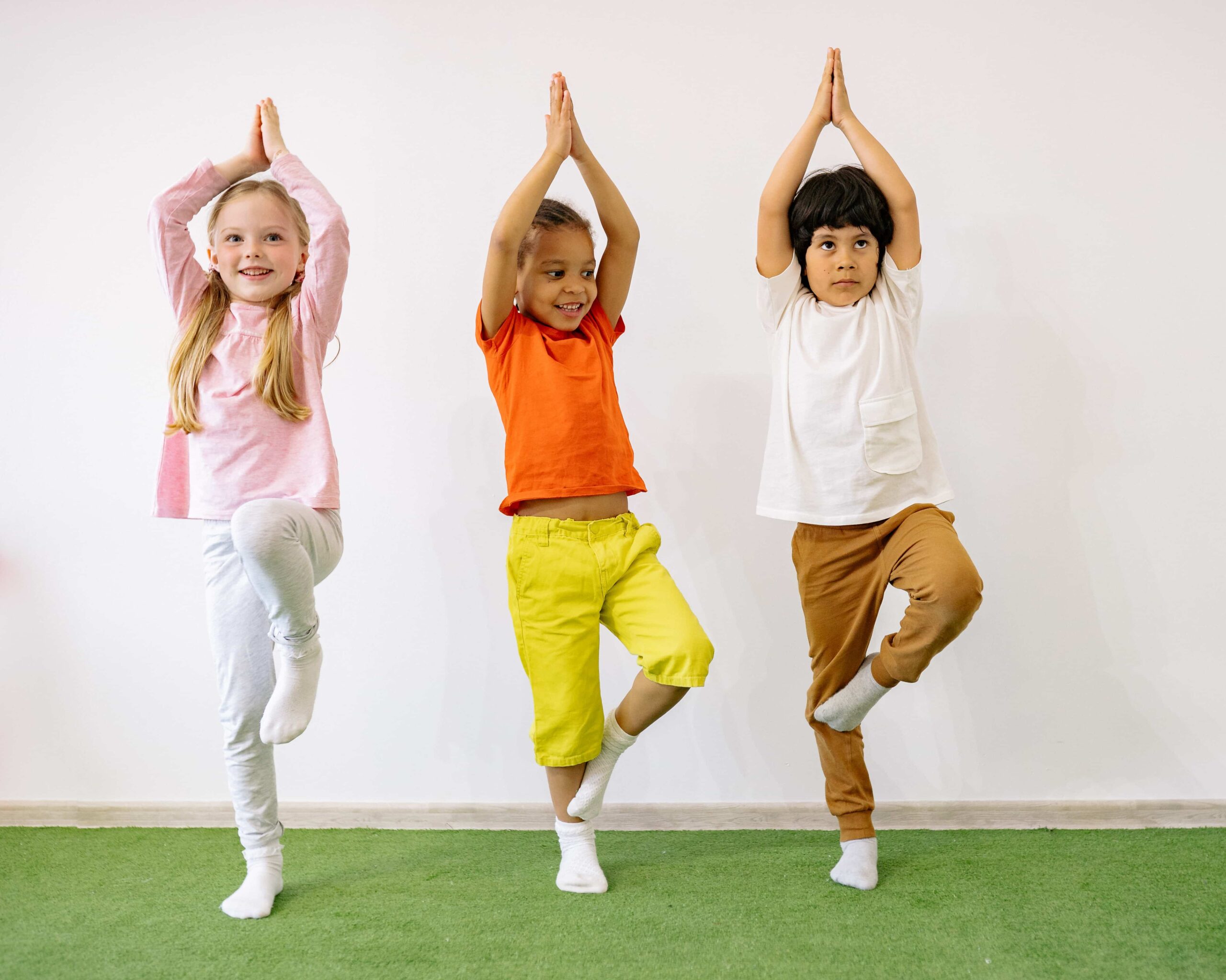 Little kids doing yoga poses