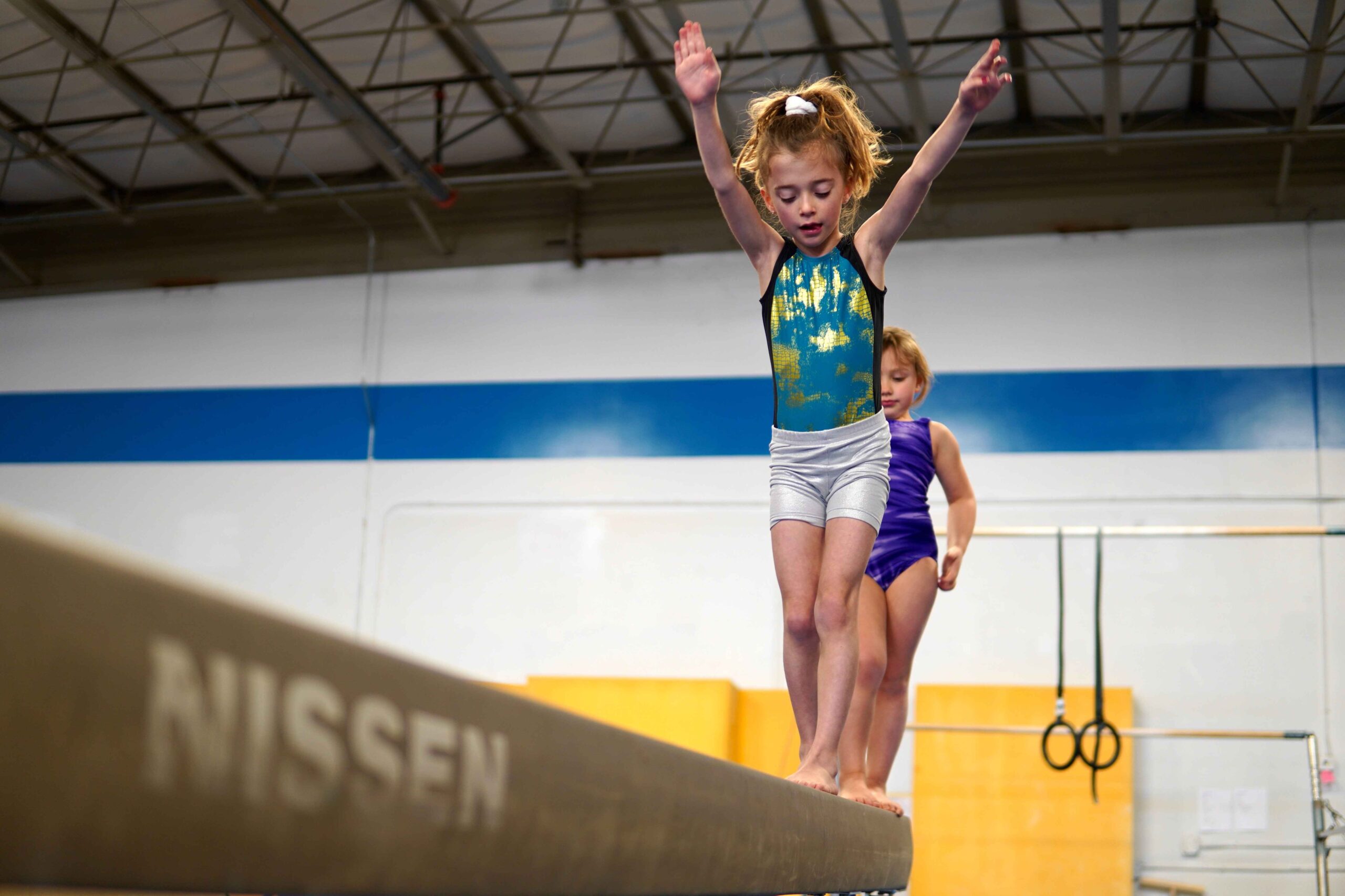 Girl on beam gymnastics