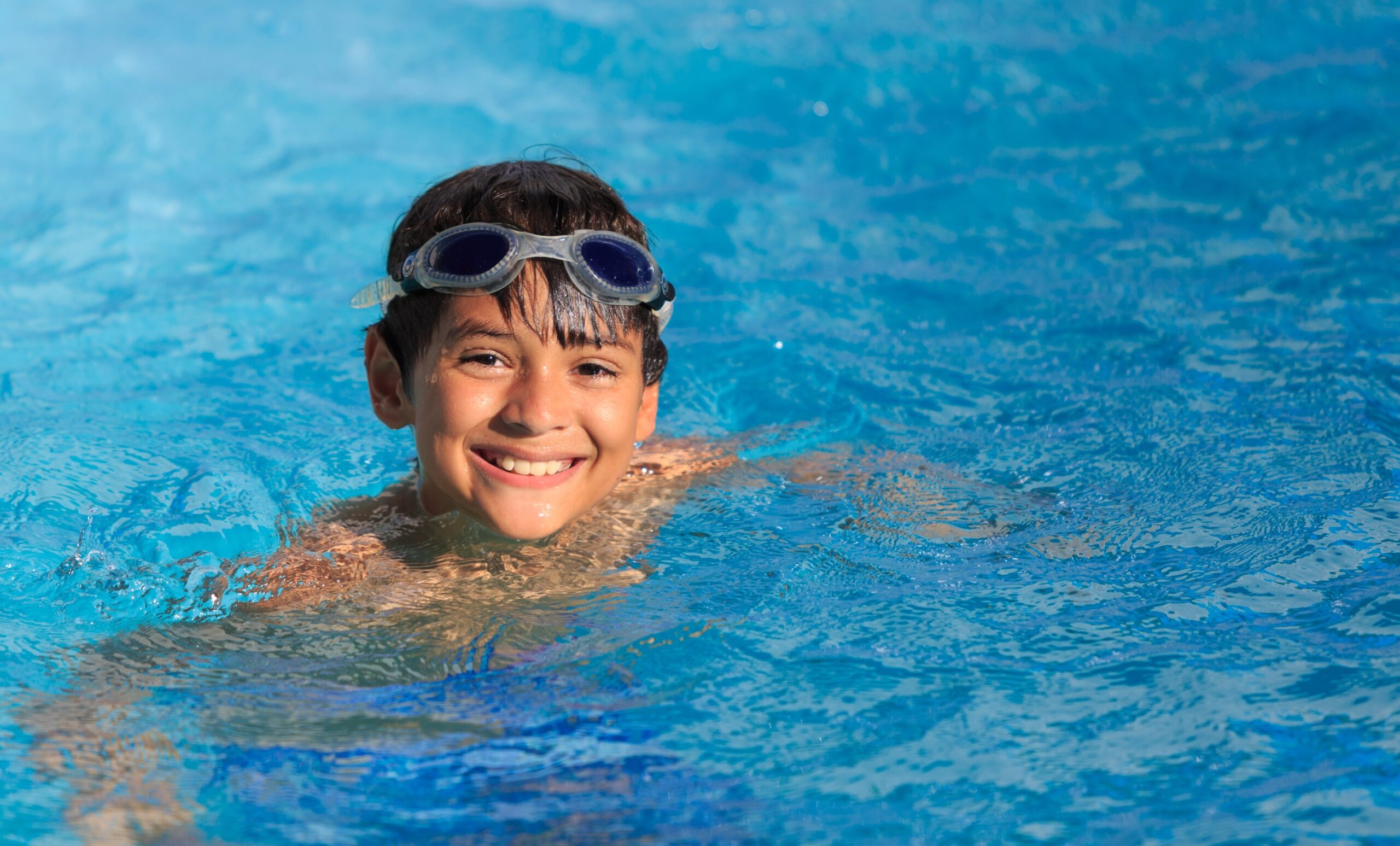 Child smiling in pool