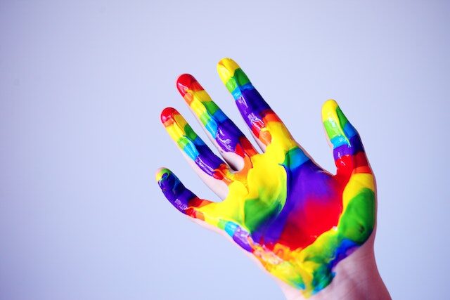 Colorful rainbow painted hand