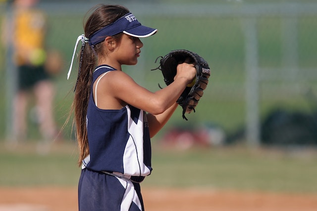 Elementary little girl on softball field