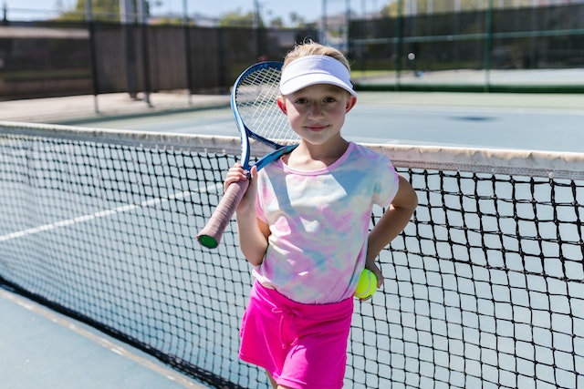 Little girl with tennis raquet