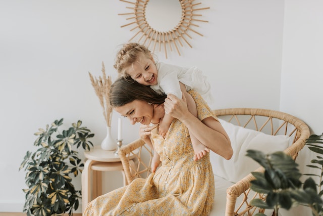 Mom and baby girl playing