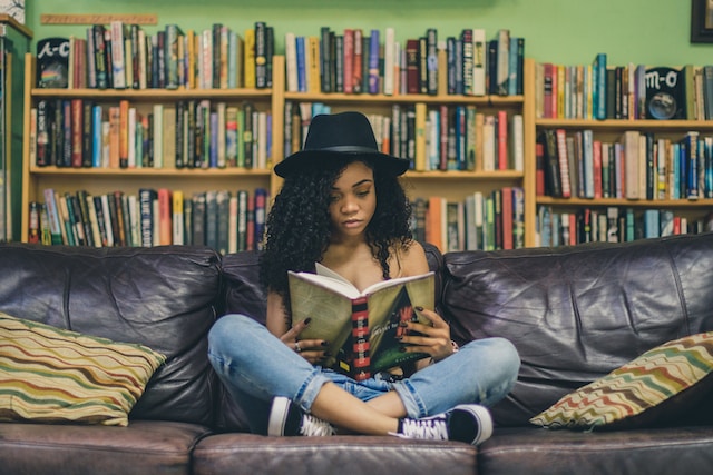 Teen reading on couch