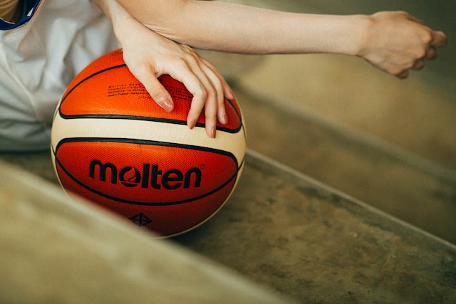 Close up of women girl holding basketball